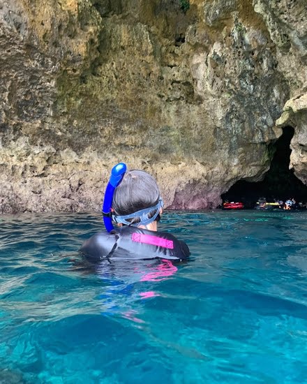 Woman swimming in Blue Cave