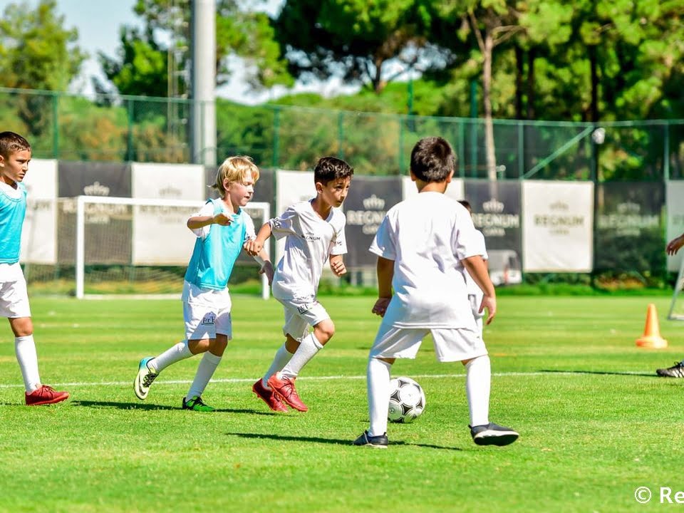 Children playing football at the Real Madrid football camp