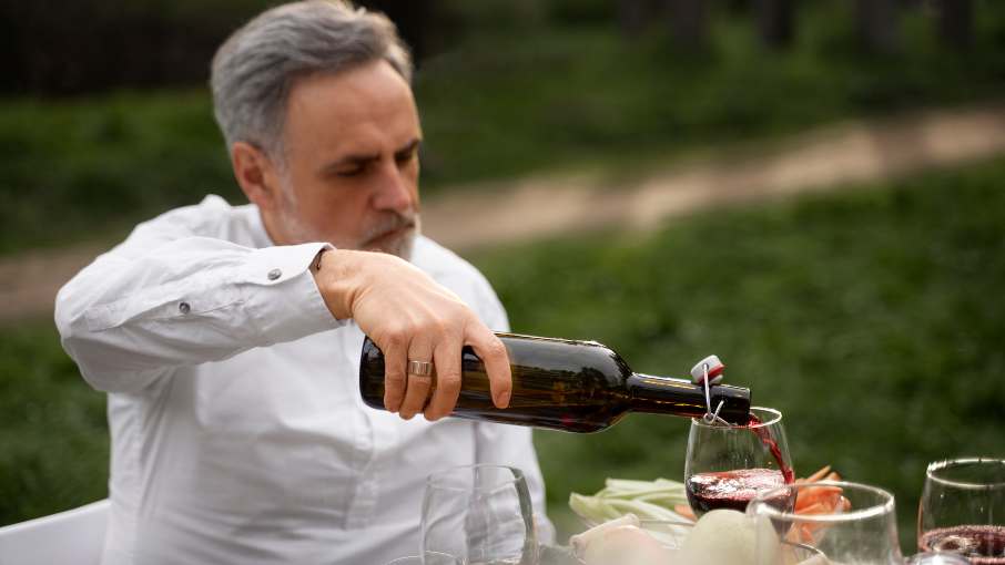 Man pouring red wine in Montenegro.