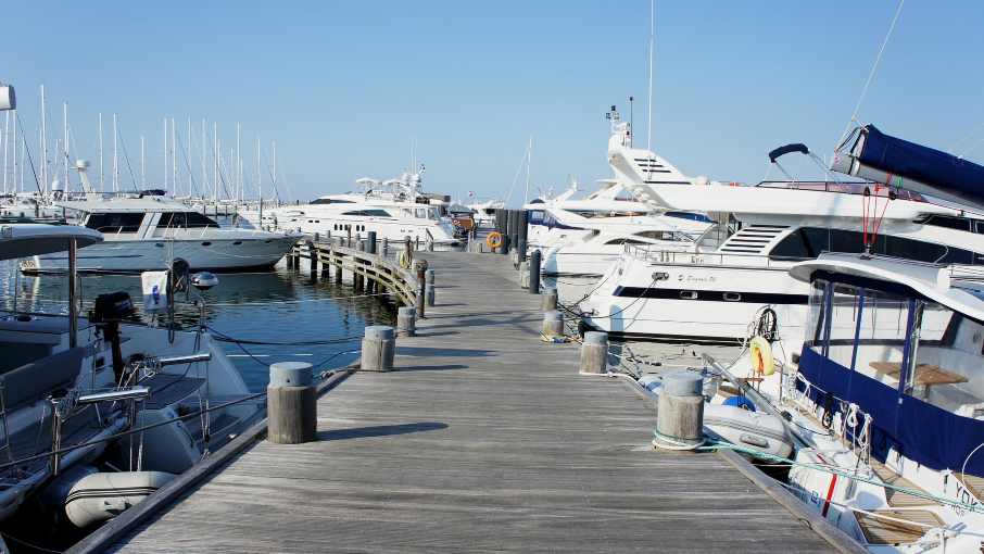 Luxury yachts docked at a marina on the Adriatic coast.