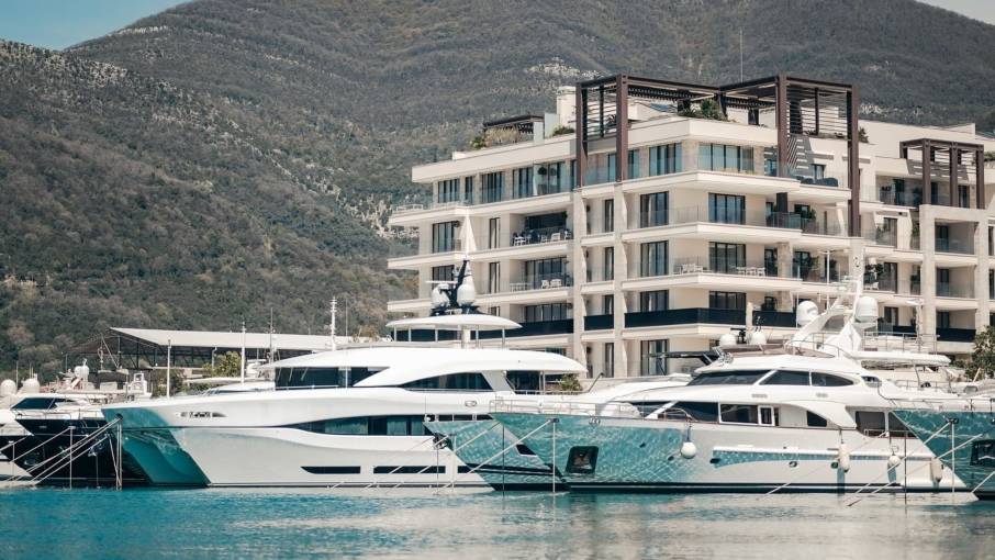Porto Montenegro Boka Place residences with modern architecture and mountain views.